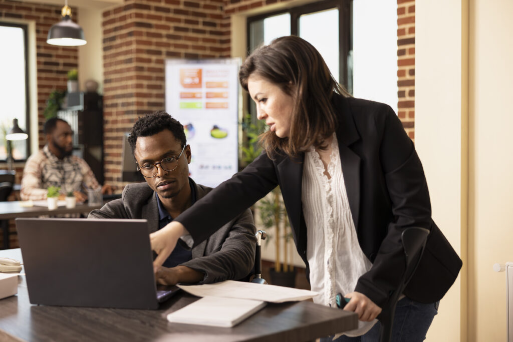 Female manager discussing with coworker