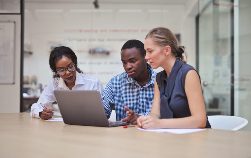 group of young people work in a modern office